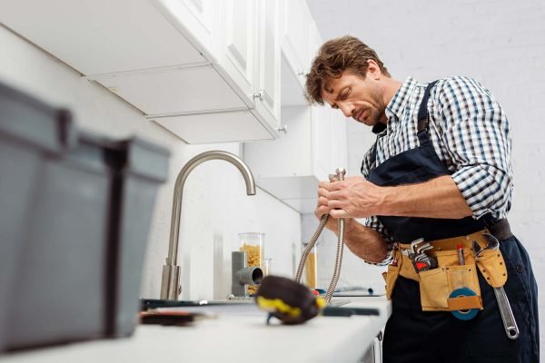 selective-focus-of-plumber-holding-metal-pipe-near-resize.jpg selective-focus-of-plumber-holding-metal-pipe-near-resize.jpg
