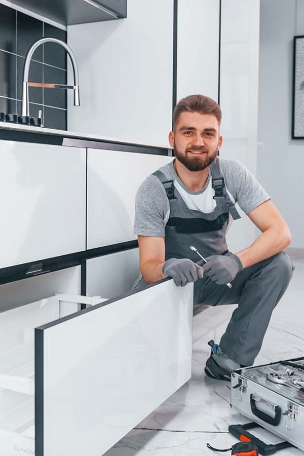 young-professional-plumber-in-grey-uniform-using-e-resize.jpg young-professional-plumber-in-grey-uniform-using-e-resize.jpg